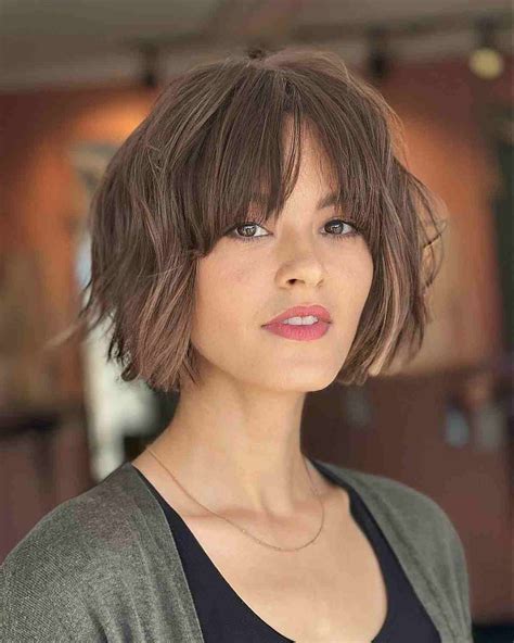 chin-length haircuts with bangs|chin length messy bob.